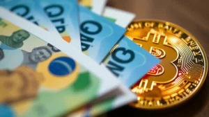 Close-up of Brazilian Real banknotes fanned out alongside a glowing Bitcoin physical representation, professional financial photography with shallow depth of field
